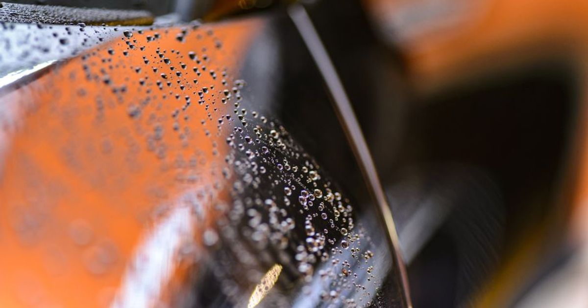 Inspecting paint scratches under shop light