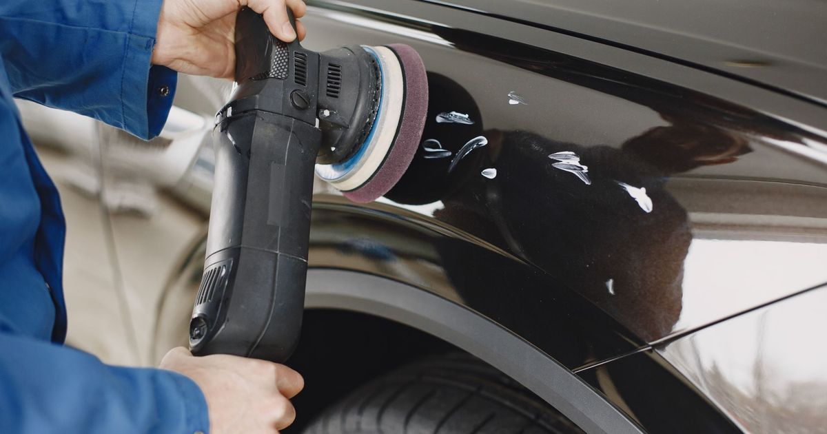 Machine polishing a car panel before ceramic coating