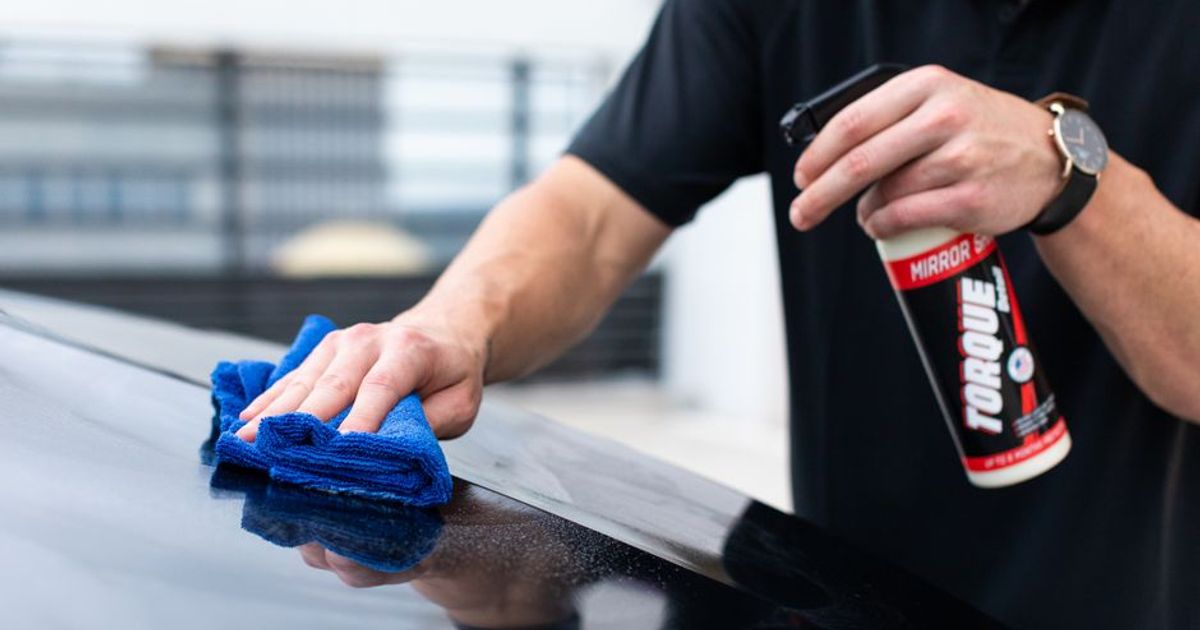 Detailer working through a full interior and exterior service