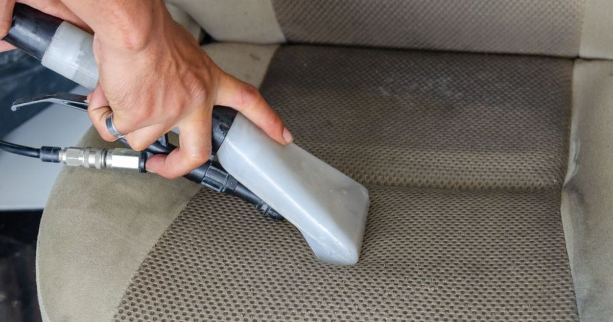Steam cleaning a vehicle interior surface